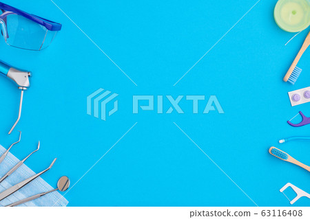 Dentist tools over blue background top view Dentist tools over blue background top view 63116408