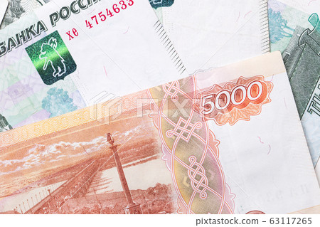 Russian ruble. Russian currency closeup in the form of texture. Russian ruble. Russian currency closeup in the form of texture. 63117265
