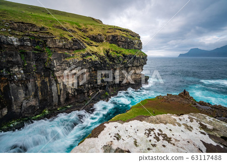 Gjogv gorge in the island of Eysturoy, the Faroe Islands. Long exposure 63117488