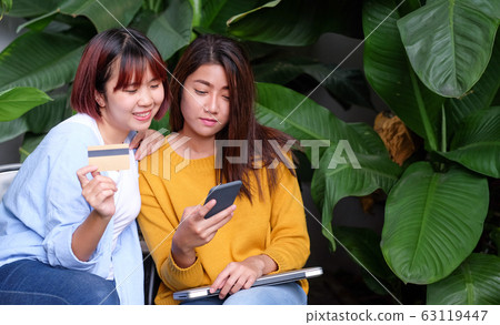 Two asia woman use credie card and e wallet on 63119447