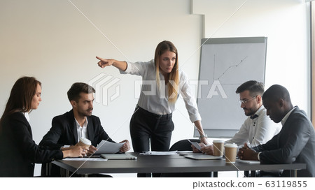 Angry female team leader director manager asking employee to leave. 63119855