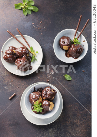 Traditional italian dessert profiteroles 63120048