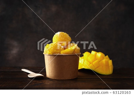 A paper cup with delicious vegan tropical sorbet A paper cup with delicious vegan tropical sorbet 63120163