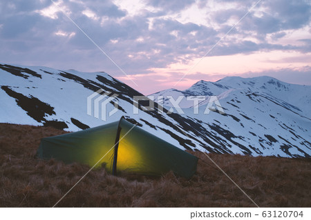 Green tent in spring mountains Green tent in spring mountains 63120704