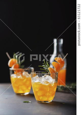 Alcoholic cocktail with mandarins Alcoholic cocktail with mandarins 63121722