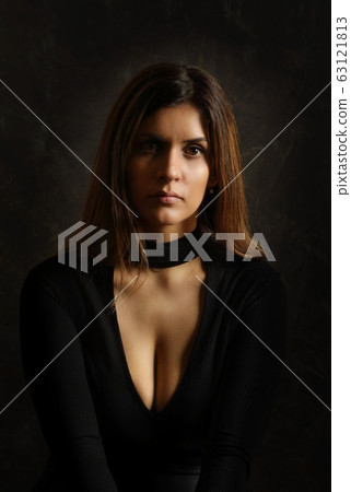 Portrait of a pretty young brunette woman in a 63121813