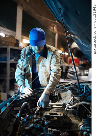 Repairman Fixing Engine Detail 63121949