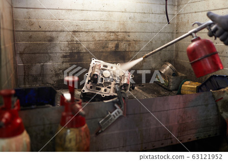 Man Using Sandblast Man Using Sandblast 63121952