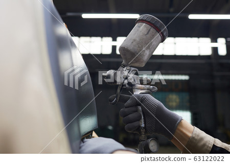 Hand With Spray-gun Painting Car 63122022