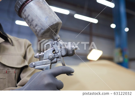 Spray-Gun With Paint In Hand 63122032