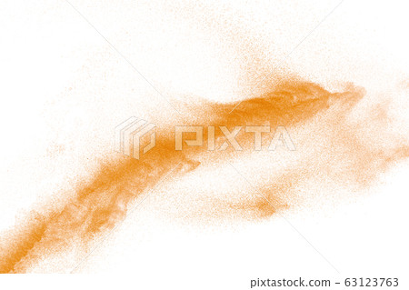 Orange powder dust particles explosion on white  63123763