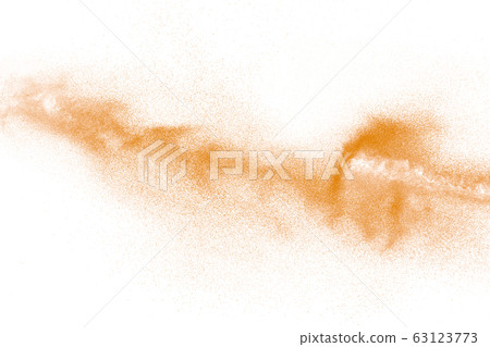 Orange powder dust particles explosion on white Orange powder dust particles explosion on white 63123773