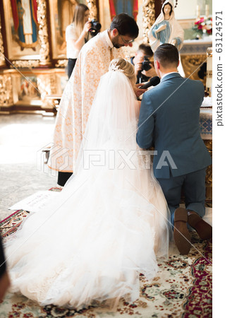 Wedding couple bide and groom get married in a church 63124571