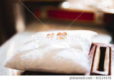 Wedding rings on ceremony at church. Macro. 63124576