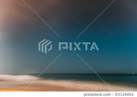 Goa, India. Real Night Sky Stars. Natural Starry Sky In Blue Color Above Indian Ocean Sea Seascape Beach Copast. Background 63126002