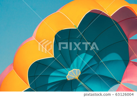 Close Multi-colored Parachute For Parasailing On Background Of Blue Sky 63126004