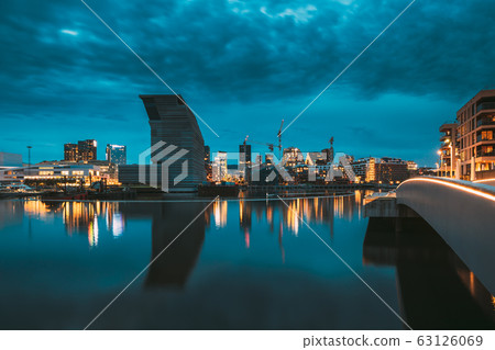 Oslo, Norway. Night View Embankment And Residential Multi-storey House In Gamle Oslo District. Summer Evening. Residential Area Reflected In Sea Waters Oslo, Norway. Night View Embankment And Residential Multi-storey House In Gamle Oslo District. Summer Evening. Residential Area Reflected In Sea Waters 63126069