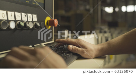 Factory Engineer Operating Hydraulic Tube Bender Factory Engineer Operating Hydraulic Tube Bender 63126070