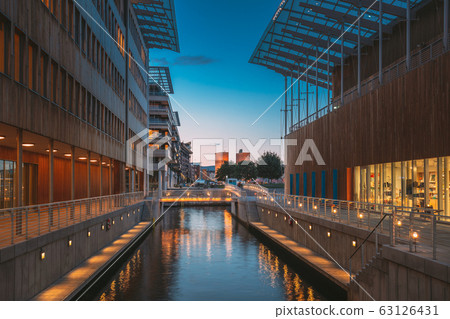 Oslo, Norway. Astrup Fearnley Museum of Modern Art, Residential Multi-storey Houses In Aker Brygge District In Summer Evening. Famous And Popular Place Oslo, Norway. Astrup Fearnley Museum of Modern Art, Residential Multi-storey Houses In Aker Brygge District In Summer Evening. Famous And Popular Place 63126431