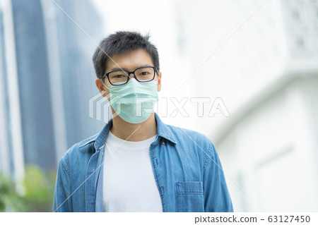 HandsomeMan wearing face mask protect filter HandsomeMan wearing face mask protect filter 63127450
