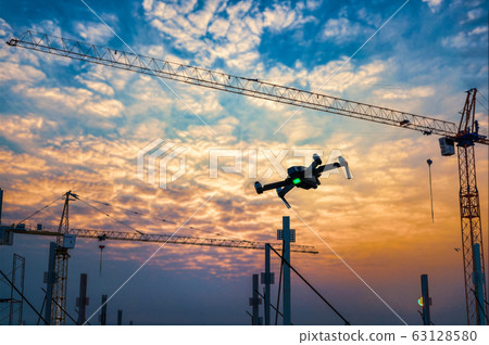 Drone over construction site. video surveillance Drone over construction site. video surveillance 63128580
