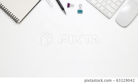 Top view office desk with computer and office supplies isolated on white background Top view office desk with computer and office supplies isolated on white background 63129042