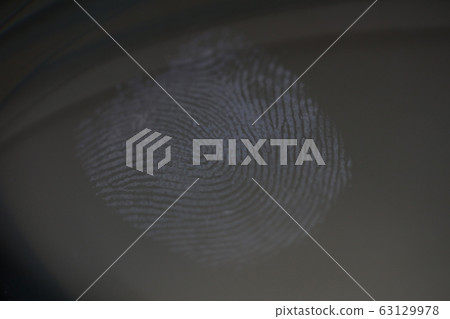Fingerprint mark on clear glass as crime evidence Fingerprint mark on clear glass as crime evidence 63129978
