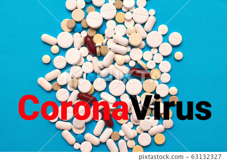 Novel coronavirus - 2019-nCoV, WUHAN virus concept. Medical tablets with CoronaVirus text. Chinese virus outbreak. Blue background. Novel coronavirus - 2019-nCoV, WUHAN virus concept. Medical tablets with CoronaVirus text. Chinese virus outbreak. Blue background. 63132327