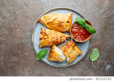 Samsa or samosas with chicken fillet 63132720