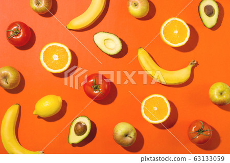 Beautiful fruits and vegetables on a bright 63133059