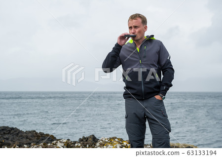 Sailor at scottish shore Sailor at scottish shore 63133194