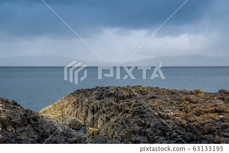 Rocks, sea and sailing boat scottish landscape Rocks, sea and sailing boat scottish landscape 63133195