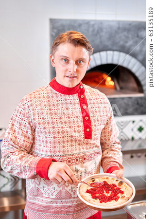 Fruit pizza. Pizza with raspberries, mascarpone and mint leaves. Traditional wood oven in restaurant, Italy. Original neapolitan pizza. Red hot coal. Fruit pizza. Pizza with raspberries, mascarpone and mint leaves. Traditional wood oven in restaurant, Italy. Original neapolitan pizza. Red hot coal. 63135189