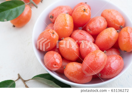 Elaeagnus berry in white bowl on backdrop,copy 63136272