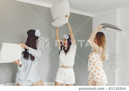 Three girls have pajamas party at home Three girls have pajamas party at home 63138844
