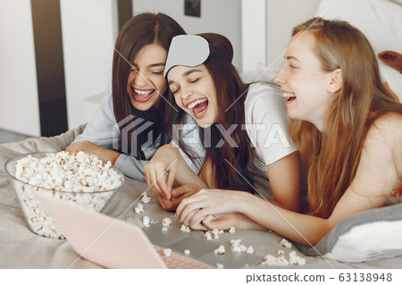 Three girls have pajamas party at home Three girls have pajamas party at home 63138948