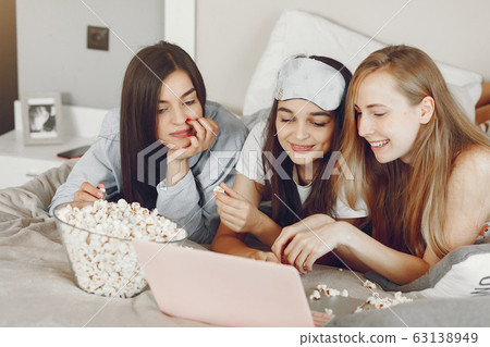 Three girls have pajamas party at home Three girls have pajamas party at home 63138949