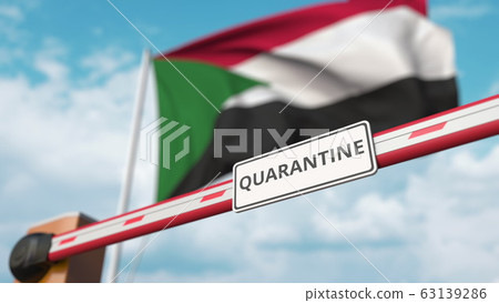 Closed boom gate with QUARANTINE sign on the Sudanian flag background. Restricted border crossing or infection related isolation in Sudan 63139286