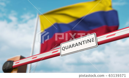 Closed boom gate with QUARANTINE sign on the Colombian flag background. Border closure or infection related isolation in Colombia Closed boom gate with QUARANTINE sign on the Colombian flag background. Border closure or infection related isolation in Colombia 63139371
