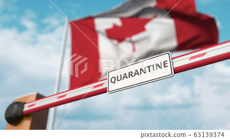 Closing boom barrier with QUARANTINE sign against the Canadian flag. Border closure or infection related isolation in Canada 63139374
