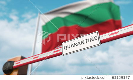 Closed boom gate with QUARANTINE sign on the Bulgarian flag background. Border closure or infection related isolation in Bulgaria 63139377
