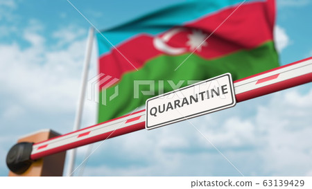 Closing boom barrier with QUARANTINE sign against the Azerbaijani flag. Border closure or infection related isolation in Azerbaijan 63139429