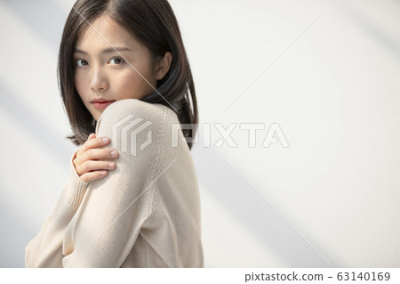 Relaxing portrait of young woman with sunshine 63140169