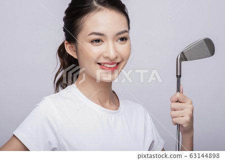 Portrait of a woman playing golf Portrait of a woman playing golf 63144898
