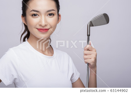 Portrait of a woman playing golf Portrait of a woman playing golf 63144902