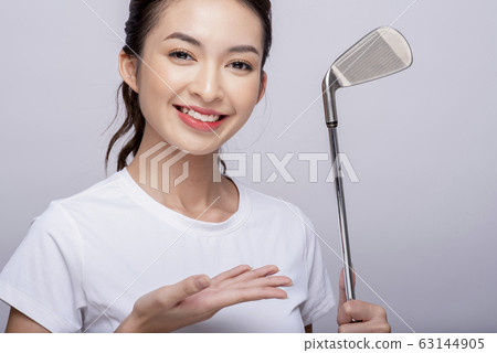 Portrait of a woman playing golf Portrait of a woman playing golf 63144905