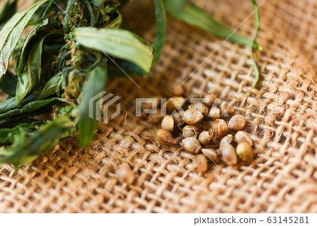 Marijuana seeds and marijuana leaf on sack 63145281