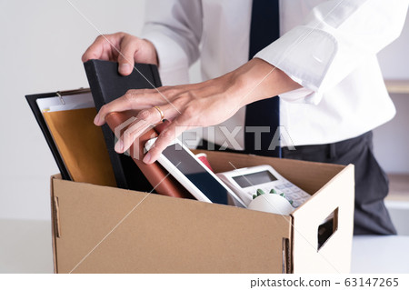 Sad Fired Young Employee businessmen hold boxes 63147265