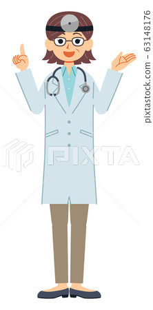A middle-aged female doctor in a white coat with a gesture to explain the whole body (head mirror and stethoscope) 63148176