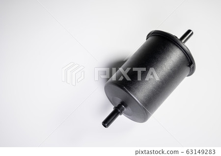 New fuel filter in a black plastic housing for diesel and gasoline engines on a gray background New fuel filter in a black plastic housing for diesel and gasoline engines on a gray background 63149283